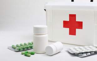 What should be in a home first aid kit during an air attack or shelling
